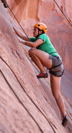 Big step rock climbing in Moab.